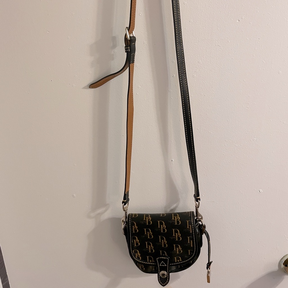 Dooney and Burke small crossover bag. See pics for measurements Blk& Brn.